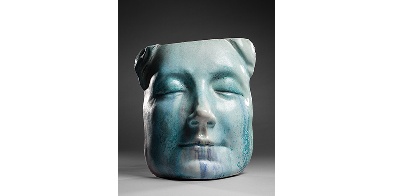 Portrait of the face in clay by Michael Warrick