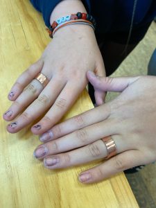 Finished Copper rings created by students during an ESSA Young Artist Program metals workshop