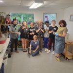 Students displaying stained glass designs created during an ESSA Young Artist Program workshop