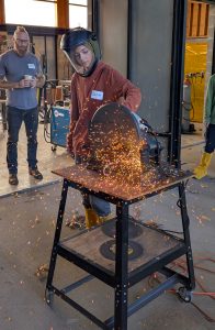 Youth participant learning blacksmithing techniques during an ESSA Young Artist Program workshop