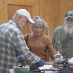 Attendees view handmade items and bid on art during the Hands On ESSA auction event