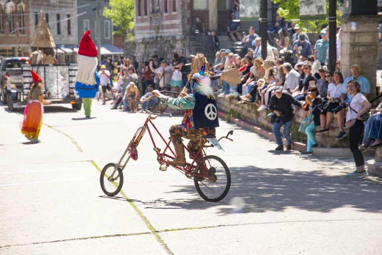 Performer rides an artistic bicycle during the ArtRageous Parade in Eureka Springs, Arkansas