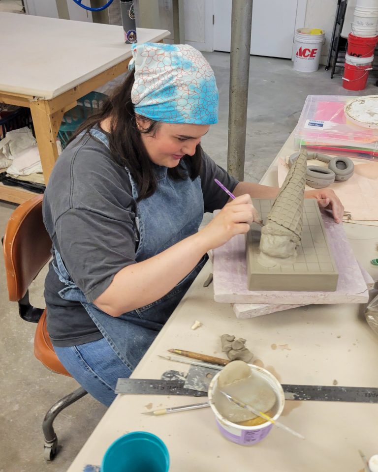 Erin Harris details an unfired ceramic ice cream cone in the ESSA Ceramics Studio during her 2026 residency.