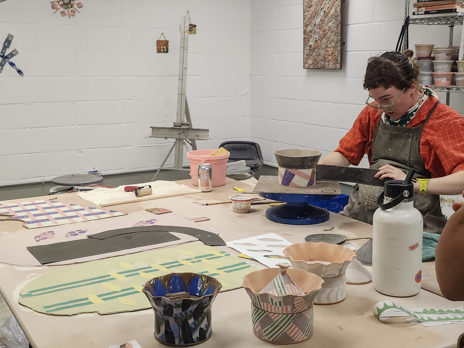 Kaitlyn Cirielli demonstrates how she uses tarpaper templates to construct ceramic vessels in the ESSA Ceramics Studio.